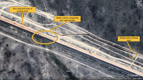 Google Earth imagery from May 12, 2023, showing the new sand base being laid and compacted north of the existing rail. Coordinates 46°55'27.46